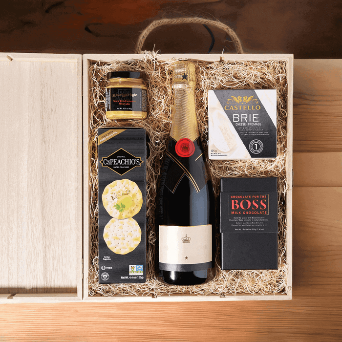 Featured in this gift box is creamy brie cheese, a brick of milk chocolate, crackers, and spicy red jalapeno mustard.