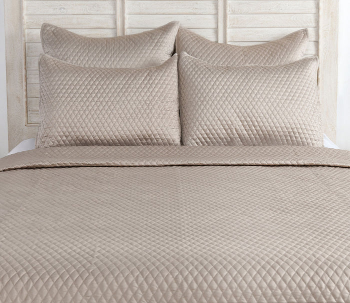 Diamond Pebble Sateen Quilted Pillow Sham by Villa by Classic Home, on bed