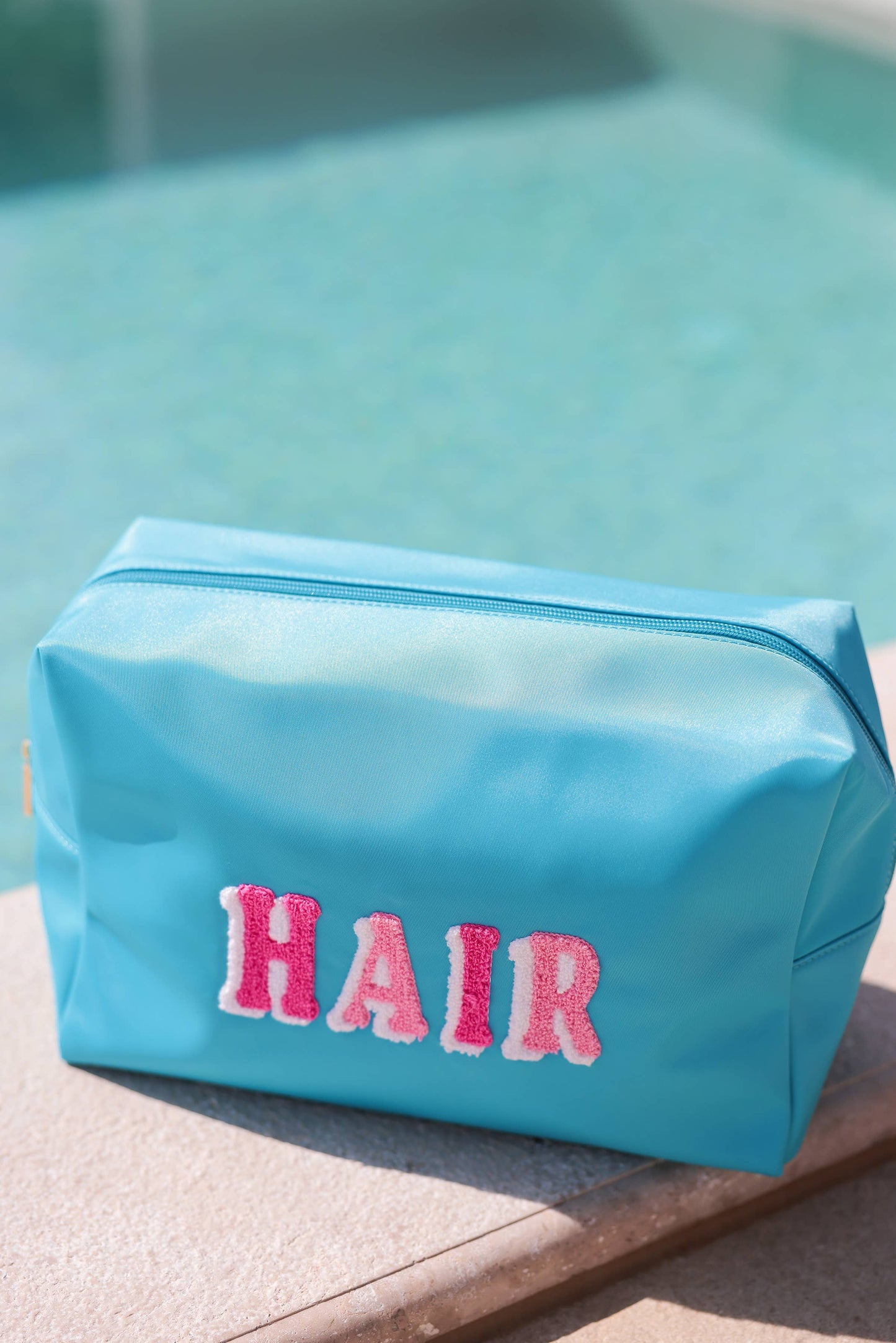 "HAIR" OVERSIZED ZIP POUCH