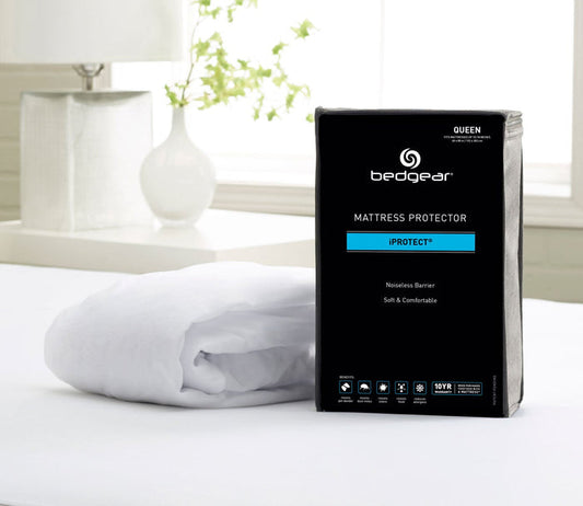 iProtect Waterproof Mattress Protector by Bedgear in room with packaging