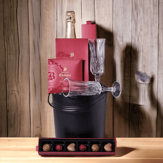 For a special celebration "Champagne & Chocolate Gift Bucket" features: chocolate covered coffee beans, chocolate truffles, a milk chocolate bar, two champagne glasses, and a bottle of sparkling wine.