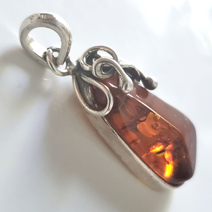 natural amber in silver pendant