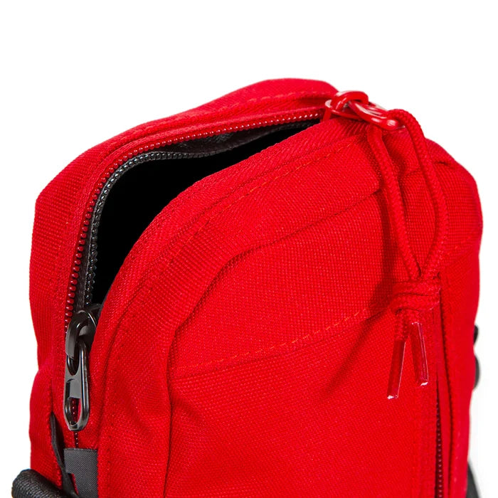 Fashionable red purse with cookie-themed accents and adjustable shoulder strap