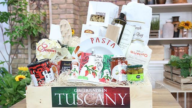 Girlfriends in Tuscany Gift Basket. Bottle of Red Wine, Versatile Pasta, Wheat Pasta, Traditional Shape of Pasta, Cherry Tomato & Roasted Garlic Pasta Sauce, Classic Green Pesto, Olive Oil, Balsamic Vinegar, Garlic Olives, Truffle Salami, Italian cheese, Chocolate Truffles, Roasted Espresso Beans, Acacia Wood Salt and Pepper Mills, 4 Piece Acacia Wood Pasta Tool Set, and a Trio Wine Box w/Burned Finish. Gourmet Gifts from Monthly Sommelier USA - Same Day USA Delivery.