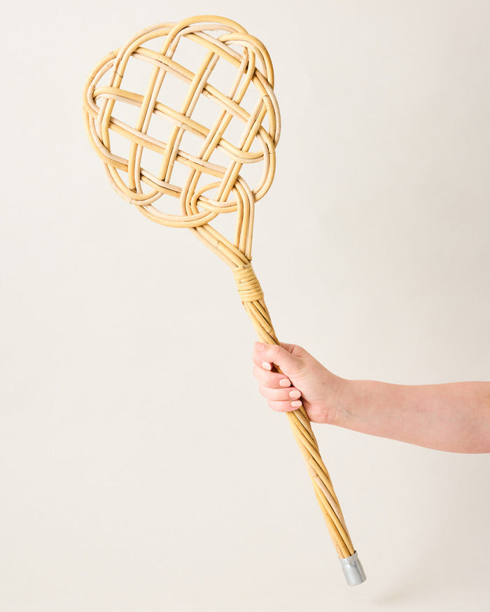 Heritage Rattan Rug Beater — rattan rug beater held by its handle; Farmhouse Pottery