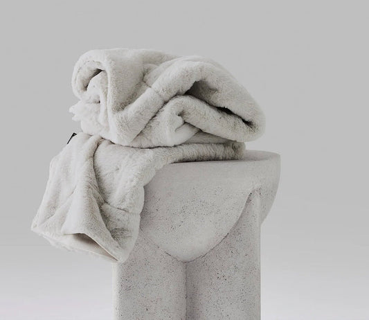 Hush Luxe Throw by Hush Blankets in ivory, silo
