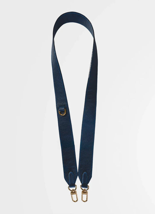Navy blue strap with gold hardware on a white background