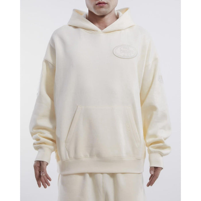 Pro Standard San Francisco 49ers Neutral Drop Shoulder Hoodie - Eggshell (FS4544637-EGG) - Stylish and comfortable hoodie featuring the iconic 49ers logo