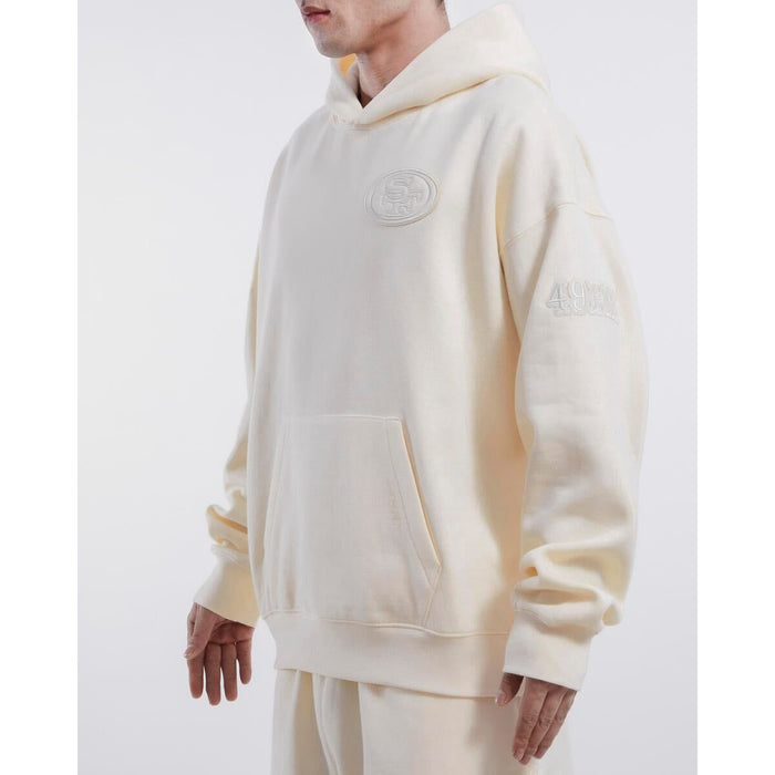 Pro Standard San Francisco 49ers Neutral Drop Shoulder Hoodie in Eggshell color, featuring the team logo and comfortable hood