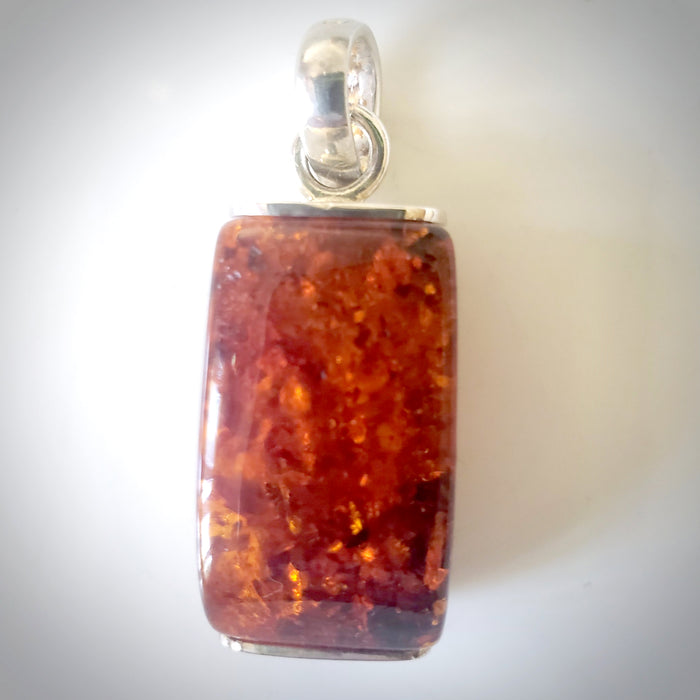 Rectangular dark amber pendant in sterling silver frame