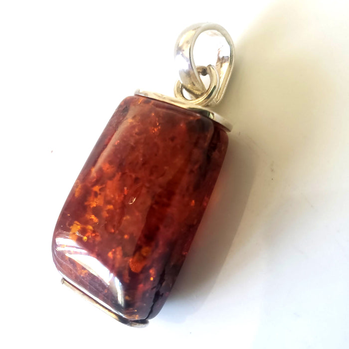 modern rectangular cognac amber pendant in sterling silver frame