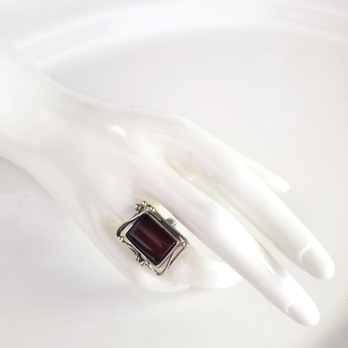 baltic cherry amber ring on hand