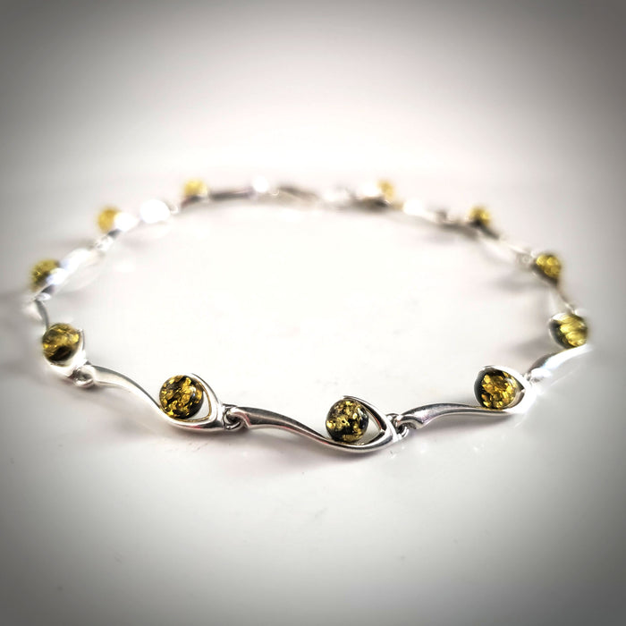 Sterling Silver large bracelet with round green natural amber beads