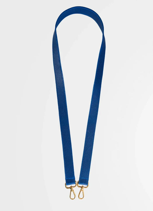 Blue strap with gold hardware on a white background