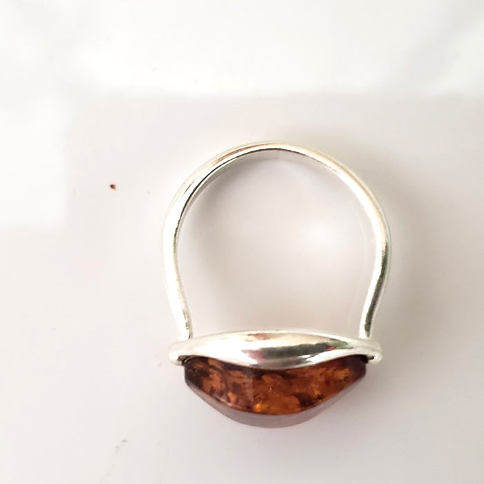 oval amber with modern cut ring