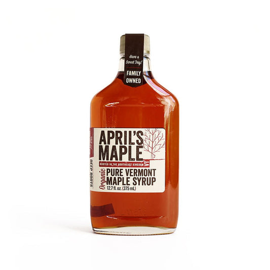 Large glass flask of April's Maple Vermont maple syrup.