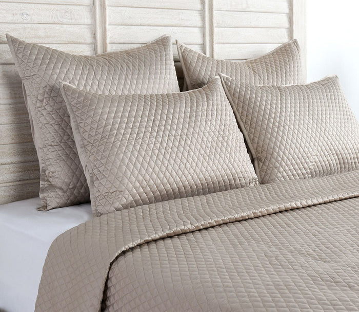 Diamond Pebble Sateen Quilted Pillow Sham by Villa by Classic Home on bed