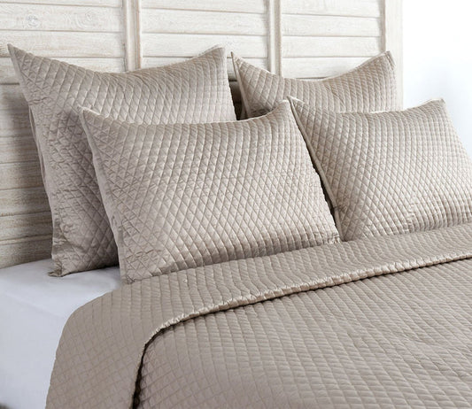 Diamond Pebble Sateen Quilted Pillow Sham by Villa by Classic Home on bed